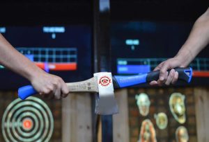 axe throwing with bar and projected targets in Dripping Springs, Texas